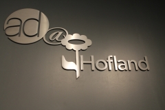 Brushed aluminium 3D letters raised from the wall for Hofland