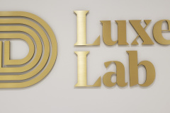 Brushed-brass-3D-logo-Luxe