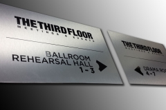 Brushed aluminium directional signs