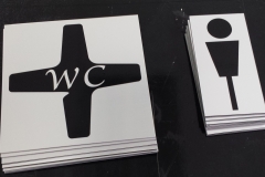 Brushed aluminium washroom signs