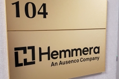 Brushed gold directional sign Hemmera