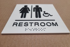 Custom-restroom-sign-with-raised-letters-and-braille