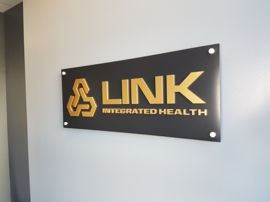Reception sign brushed gold 3D letters on aluminium panel installed raised from the wall for LINK
