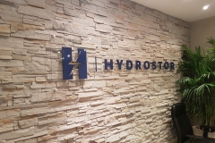 Clear acrylic reception sign with 3D raised logo Hydrostor