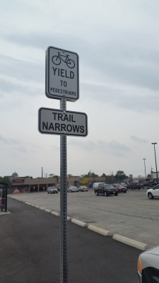 Reflective trail narrows and yeld signs