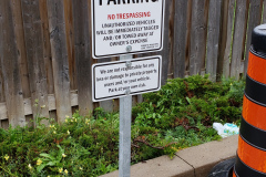 Custom-parking-sign-with-concrete-base-and-post