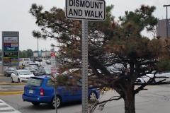 Reflective dismount and walk sign
