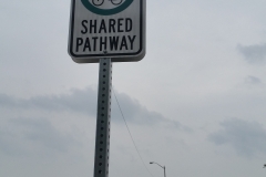 Reflective shared pathway sign