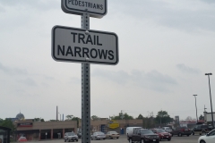 Reflective trail narrows and yeld signs