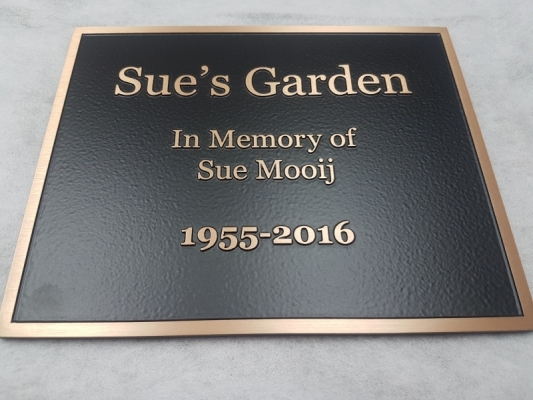 Raised text bronze plaque Sue's Garden