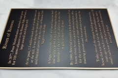 Bronze plaque with raised text