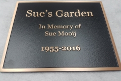 Raised text bronze plaque Sue's Garden